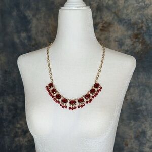 New red crystals with gold colored chain necklace